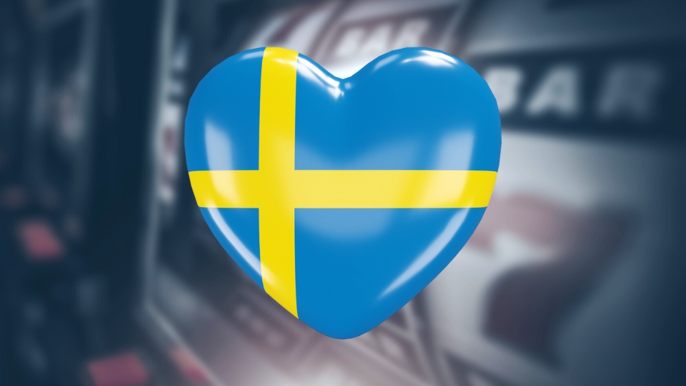 Hjärta med svenska flaggan framför casinospel