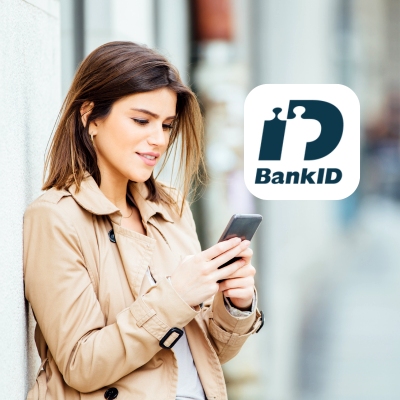 Kvinna med mobil och BankID logo