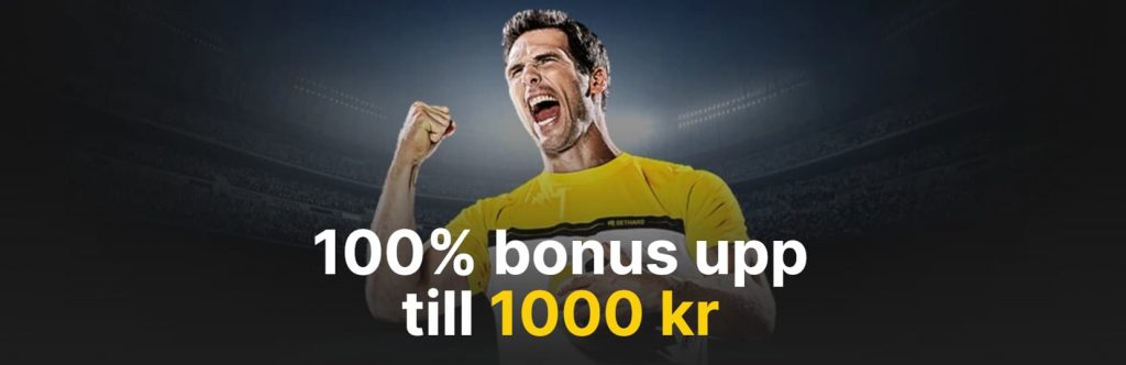 man som gör en segergest i en mörkt upplyst stadium